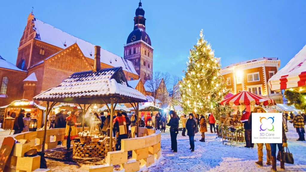 A festive outdoor Christmas market with people gathered around stalls, a large decorated tree, and snow covering the ground and buildings at dusk.